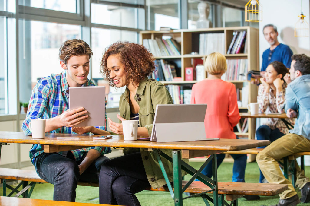 digital-designers-at-office-table-looking-at-digit