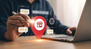 a local seo expert using laptop to manage online presence, reviews, and local search optimization for business
